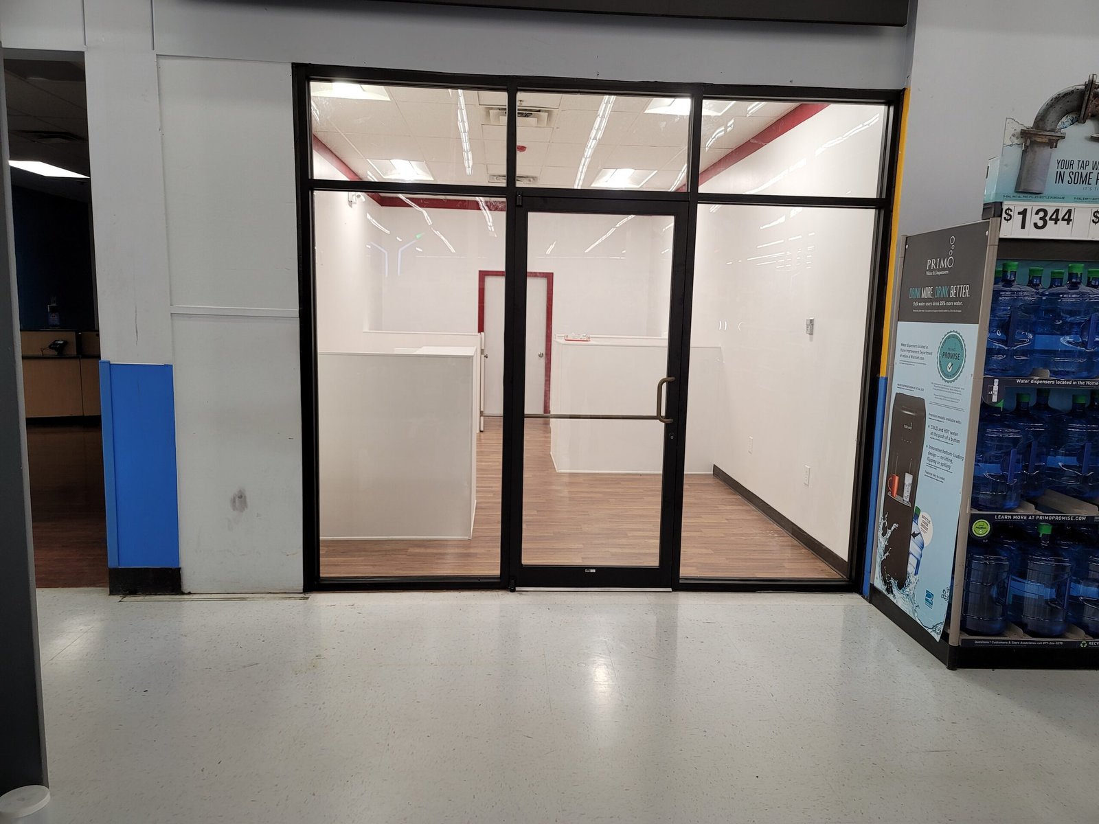 Interior aluminum and glass storefront with door for a new tenant space